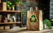 © Nattapat - Sustainable brown paper bag with green recycling logo, 100 recyclable and reusable, promoting ecoconscious practices and environmental safety