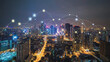 © Teeraphon - Smart digital Innovation city with connection network reciprocity over the cityscape. of future smart wireless city and social media networking systems that connects business people with in city