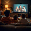 © MohammadJavad - family watching tv and eat popcorn at home