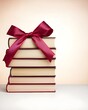 © Narit - Stacked books tied with a red ribbon for a thoughtful gift