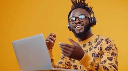 Wall Mural - a man in a yellow shirt is wearing headphones and smiling while using a laptop. concept of happiness