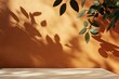 © firdan - Background for branding products, cosmetics, food or jewellery presentation. Empty table on bright brown wall background. Composition with leaves shadow and beautiful light on the wall.