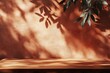 © firdan - Background for branding products, cosmetics, food or jewellery presentation. Empty table on bright brown wall background. Composition with leaves shadow and beautiful light on the wall.
