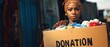 © Rifena - A Woman's Determination: Carrying a Donation Box