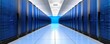 © Aventurine - A modern data center corridor featuring rows of blue server racks, illuminated by overhead lights, creating a sleek and high-tech atmosphere.