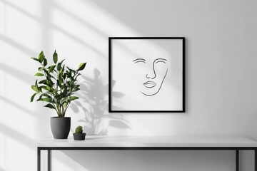 Aufkleber - A simplistic line art piece in a frame is placed on a white table, flanked by potted plants, casting soft shadows in a minimalist space filled with natural light.