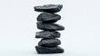 © Giovanni - stacked black coal rocks isolated on white background showcasing balance and stability in natural materials