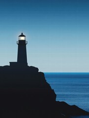 Poster - Lighthouse silhouette stands against a darkening sky over a rocky coastline at twilight. Generative AI