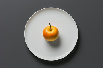 Sticker - A white plate with a single piece of fruit centered on it. 