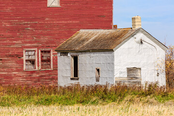 Wall Mural - A red and white house with a white roof and a white door