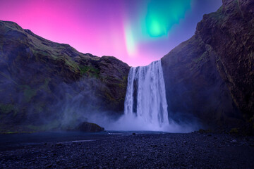 Wall Mural - aurora borealis over famous skogafoss waterfall on skoga river, iceland. gorgeous icelandic landscap