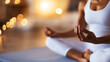 © Helga - A serene woman practicing meditation in a seated position on a yoga mat in her bright and peaceful home. Perfect for content on mindfulness practices, stress relief through meditat