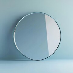 Poster - Circular glass mirror on pale blue background.