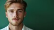 © 2rogan - Confident young man portrait with natural green background and empty space for personalized text or messages