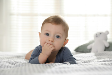 Wall Mural - Cute little baby on bed at home