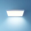 © Nurul - Square LED ceiling light illuminates a blue wall.
