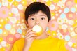 © Halina Berah - The content little boy is happily eating a mango as part of his lockdown activities.