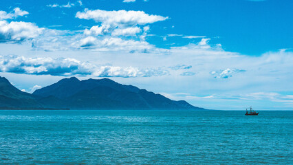 Wall Mural - Beautiful coastal scenery new zealand kaikoura blue mountains ocean stunning summer day