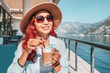 © EdNurg - Tourist enjoying a cappuccino in a bar with a sea view