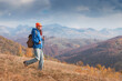 © EdNurg - Hiker girl enjoying a sunny autumn day in the mountains