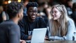 © AzSteel - Three Young Friends Engaging in Collaborative Discussion at a Trendy Café, Smiling and Sharing Ideas, with a Laptop and a Relaxed Atmosphere