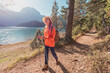 © EdNurg - Woman hiking along Black Lake enjoying the beautiful mountain landscape in Durmitor National Park, Montenegro