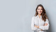 © Rgfx - Happy young business woman posing isolated over grey wall background