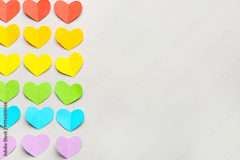 Colorful paper hearts on grey background. Valentine's Day celebration