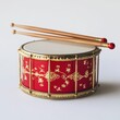 © CoolPook - A red and gold drum with a gold and red design sits on a white background