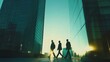 © WS Studio 1985 - Urban Ambitions: Three business professionals stride confidently between towering skyscrapers, silhouetted against a vibrant sunrise, symbolizing ambition, progress, and the pursuit of success.