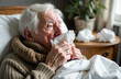 © fibeelf - Sick old grandfather lying in bed and blowing his nose into his handkerchief
