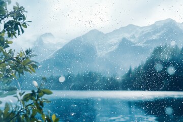 Wall Mural - A mountain range with snow on the top. The mountains are in the background. The lake is in the foreground