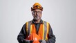 © jureephorn - A composed portrait of a construction worker in high-visibility clothing and protective gear, holding an orange helmet with pride, set against a clean white background