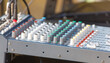 © schankz - A mixing board with many knobs and buttons