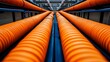 © Jullia - Dynamic Composition of Perspective Orange Pipes in Industrial Setting - Trends in Modern Stock Photography