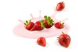 © neyostudio - Fresh strawberries splashed in pink liquid, showcasing a vibrant and appetizing scene.