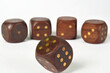 © Luigi Bertello Photo - A group of five large wooden gaming dice on a white background