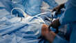 © wedmoments.stock - The surgeon performs endoscopic manipulations on the kneecap. The doctor performs arthroscopic surgery on the knee or joint in the operating room using modern arthroscopic instruments.