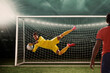 © IndiaPix - Goalkeeper catches the ball . At the stadium, in the spotlight.