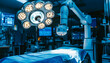 © Putu - Robotic surgery arm and surgical lamps in a modern operating room.  High-tech medical equipment ready for procedure.