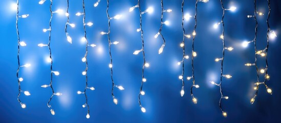 Aufkleber - Twinkling white fairy lights against a serene blue background creating a soothing nighttime ambiance and festive atmosphere