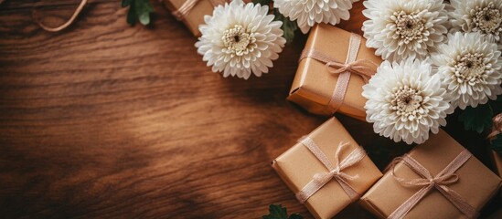 Aufkleber - Charming white chrysanthemum flowers paired with elegant gift boxes on a rustic wooden table creating a festive and inviting atmosphere