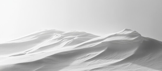 Aufkleber - Serene winter landscape of white snow-covered hills under a soft grey sky creating a minimalist and tranquil atmosphere