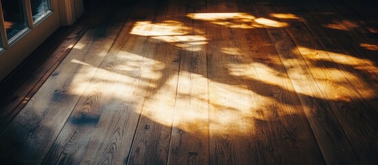 Poster - Cozy wooden floor illuminated by soft sunlight creating warm shadows and inviting atmosphere in a tranquil indoor space
