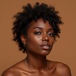 © ILIUSIA - Woman with natural curls and glowing skin on warm background,Mocha color 2025.
