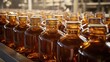 © bulegendut - Amber glass bottles on a factory conveyor belt.
