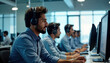 © Pete - Indian call center employees working in a modern office. They wear headsets and are focused on computers. They appear to be providing support. It is likely a busy day at work.