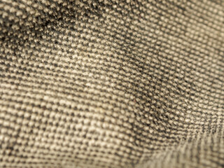 macro photography of fabric texture, detailing soft waves and patterns, creating an impression of ta