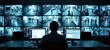 © Pete - Security analyst in darkened control room monitors wall of surveillance screens. Person in tech workspace intently observes live feeds from various cameras. Dark room with modern tech equipment shows