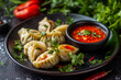 © Nadezda Ledyaeva - Chicken steam momo. Nepalese Traditional dish Momo stuffed with chicken and then cooked and served with sauce over a rustic wooden background, selective focus